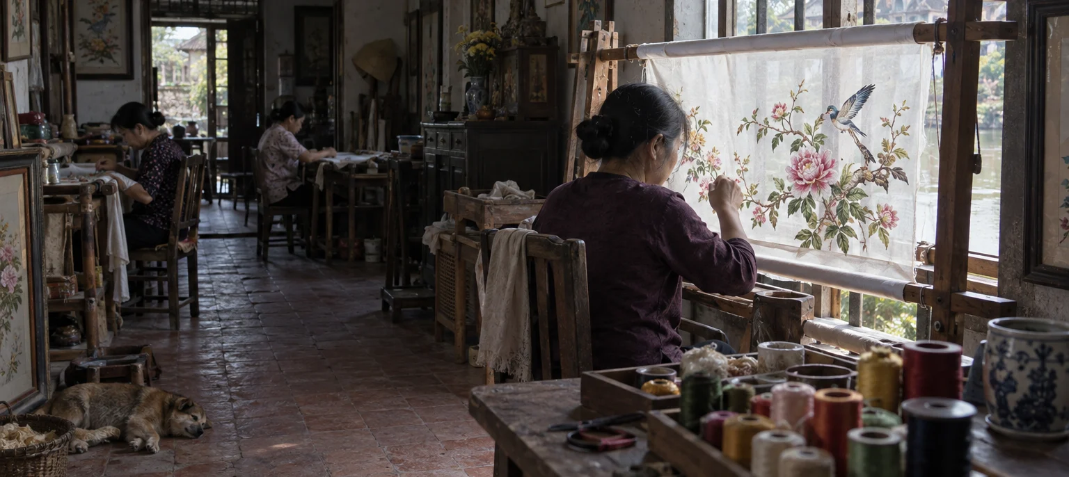 Wide view of an embroidery room in Quất Động, a wooden frame set in the window, silk in morning light, spools on a table, hand embroidery village, Red River Delta, Vietnam